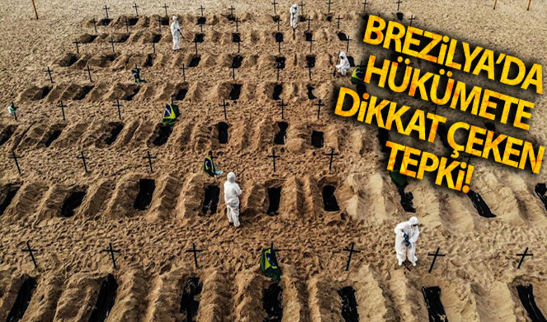 Brezilya'nın ünlü plajında kazılansembolik mezarlarla hükümete tepki - Brezilya`nın ünlü Copacabana plajında yeni tip korona virüs (Covid-19) salgınına karşı önlem almayan hükümete tepki amacıyla 100 mezar kazıldı.