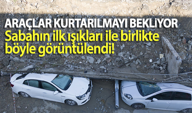 İstanbul'da istinat duvarının altındakalan araçlar kurtarılmayı bekliyor - Esenyurt dün şiddetli yağmur dolayısı ile bir konteyner galerisinde toprak kayması meydana geldi.