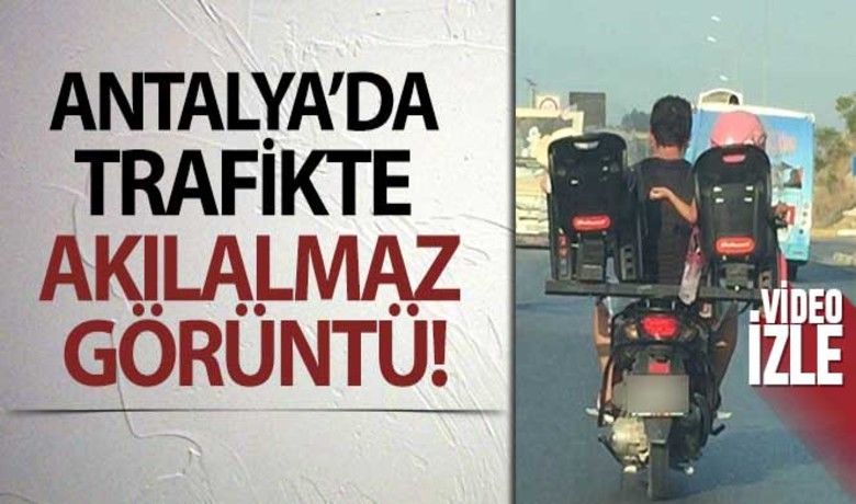 Antalya'da trafikte akılalmaz görüntü: Motosikletsürücüsü baba iki çocuğunu böyle taşıdı - Antalya’da bir babanın motosiklet arkasına yaptırdığı düzeneğe koyduğu iki çocuğu ile birlikte tehlikeli bir şekilde seyahat etmesi büyük tepki çekti. Yaşanılan o anlar cep telefonu kamerası ile kaydedildi.