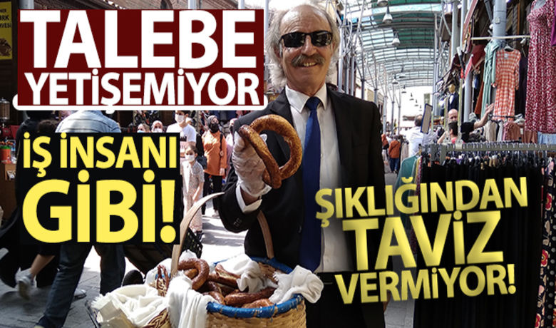İş insanı gibi giyinipçarşıda sepetle simit satıyor - Bursa'da takım elbise giyip, kravat takarak seyyar simitçilik yapan vatandaş, talebe yetişemiyor.Burak Türker-İHA
