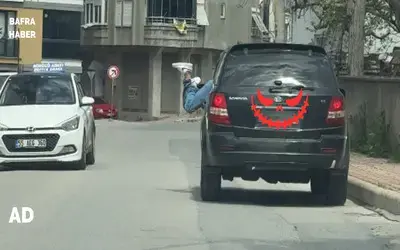 Bafra’da Trafikte Tehlikeli Görüntü: Seyir Halindeki Araca Kafasını Soktu